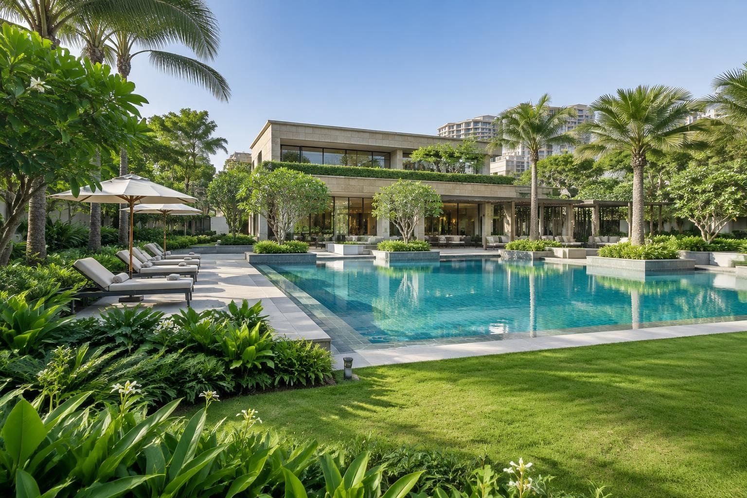 Clubhouse pavilion beside a long swimming pool, framed by palms and lawns. Not the Sector 92 project.